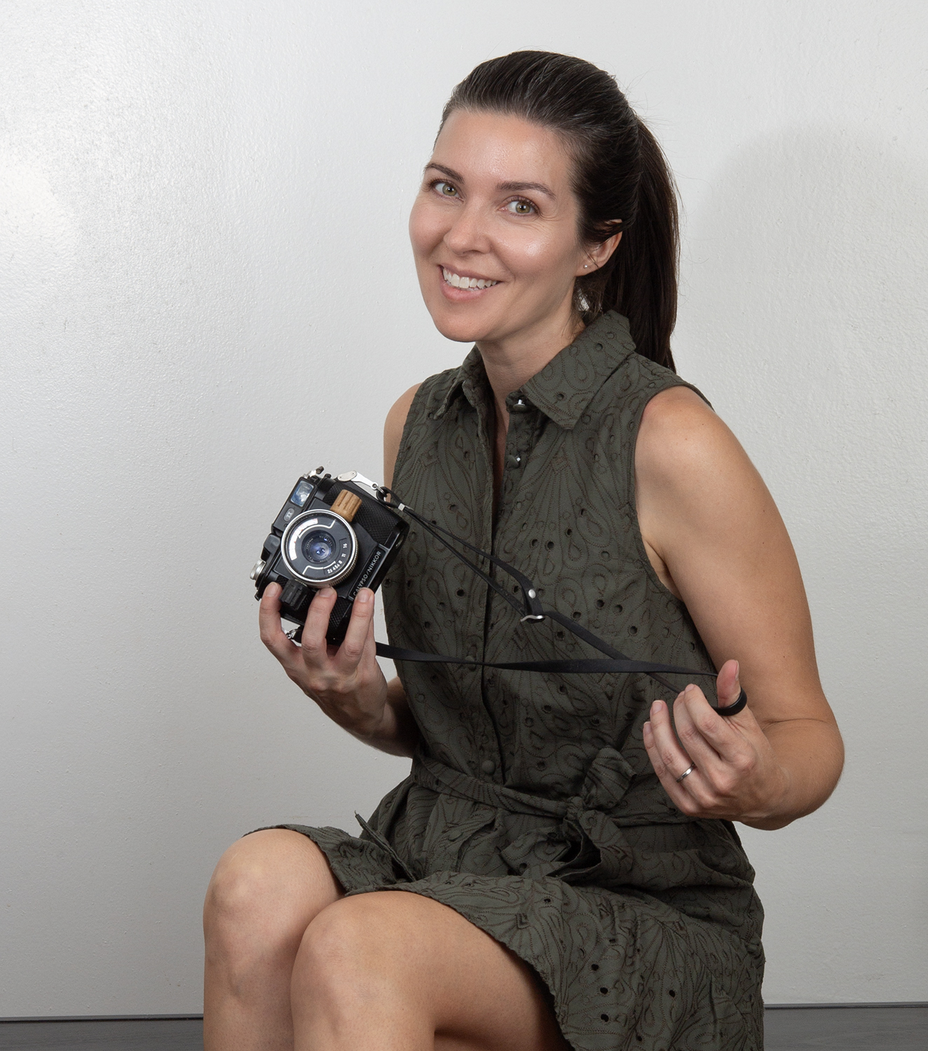 Madeline Vega with Nikor camera in Brooklyn