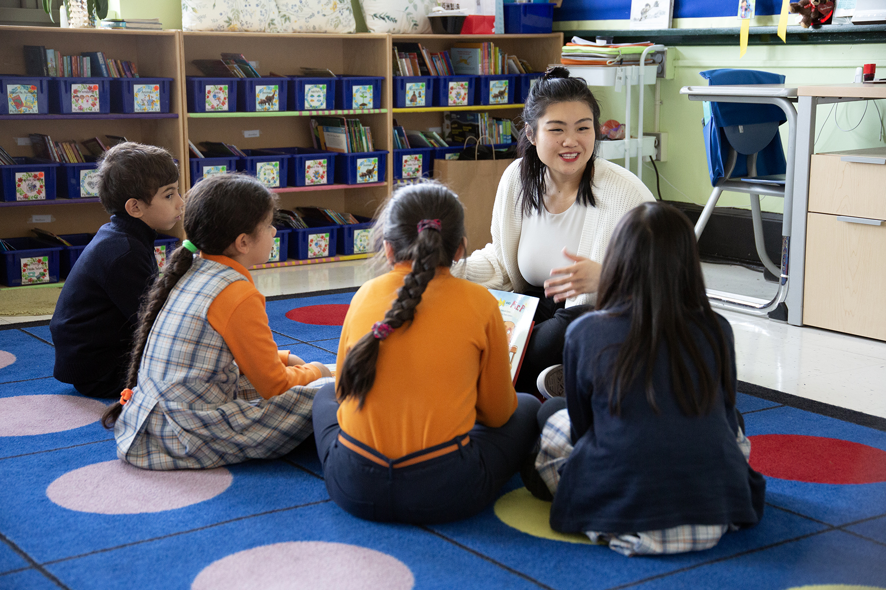 Ms Zou talks through story with her reading group